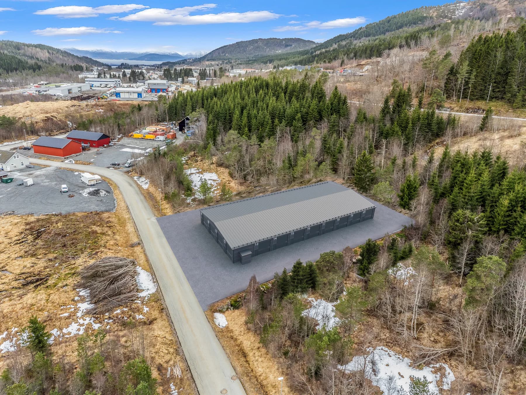 Illustrasjon: fotomontasje av bygget plassert på tomta i Molde, sett fra lufta
